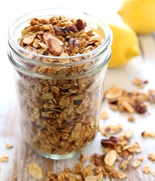 Mason jar overflowing with Nutty Granola.