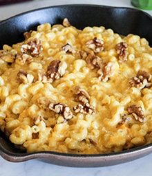 Cast iron of Butternut Squash Mac and Cheese with Walnuts.