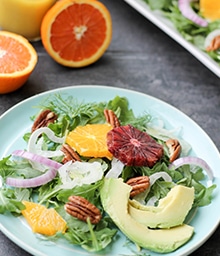 Plate of Orange, Fennel, and Pecan Salad with Honey Mustard Vinaigrette.