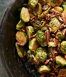 Plate of Roasted Brussels Sprouts with Pecans and Bacon.