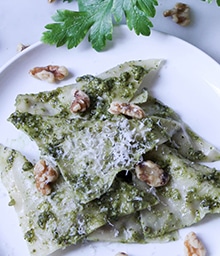 Plate of Mushroom and Cheese Ravioli with Walnut Pesto.