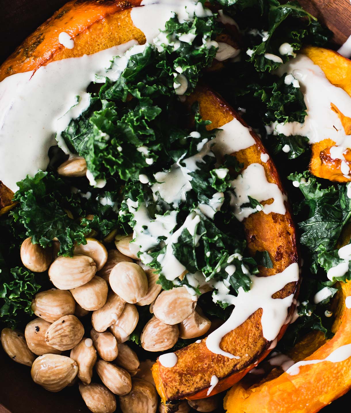 Close-up of Roasted Red Kuri Squash with Tahini Greens.