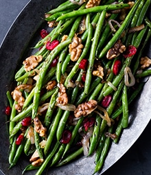 Plate of Roasted Green Beans with Walnuts, Lemon, and Cranberries.
