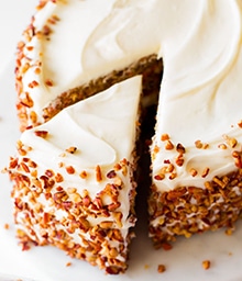 One slice being taken from Sally's Baking Addiction's Favorite Carrot Cake.