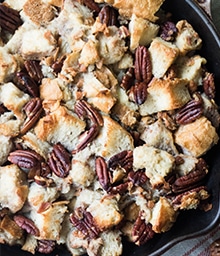 Cast iron of Sourdough Stuffing with Pecans, Sage, and Pancetta.