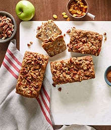 Three Spiced Apple Loaves on a cutting board.