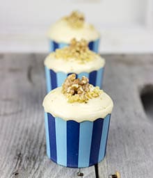 Line of three Spiced Maple Walnut Cupcakes.