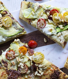 Sliced Summer Vegetable and Ricotta Flatbread with Pesto.