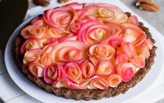 Apple Custard Rose Tart with beautiful floral design on top.