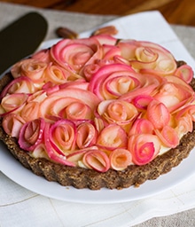 Apple Custard Rose Tart with beautiful floral design on top.