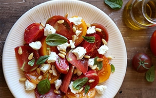 Tomato Salad with Goat Cheese and Pine Nuts.