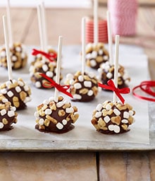 Tray of Truffle Pops tied with red ribbons.