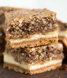 Stack of two Hazelnut Pecan Cheesecake Bars.