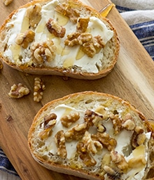 Walnut Goat Cheese Toasts on cutting board.