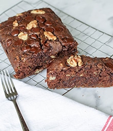 Loaf and slice of Double Chocolate Walnut Zucchini Bread.